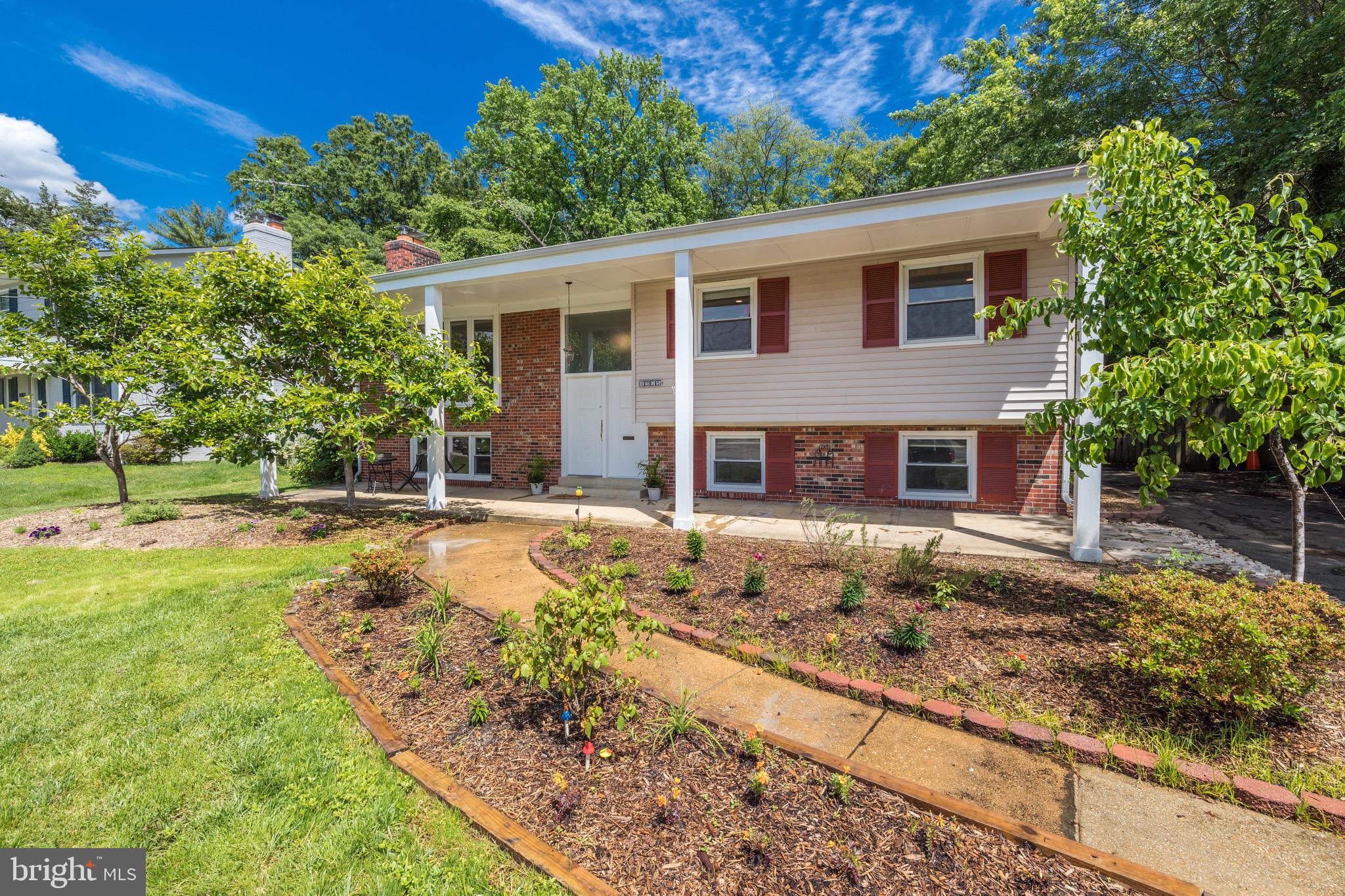 8305 Fort Hunt Road Alexandria, VA 22308 - Photo 73 of 74 a front view of a house with garden