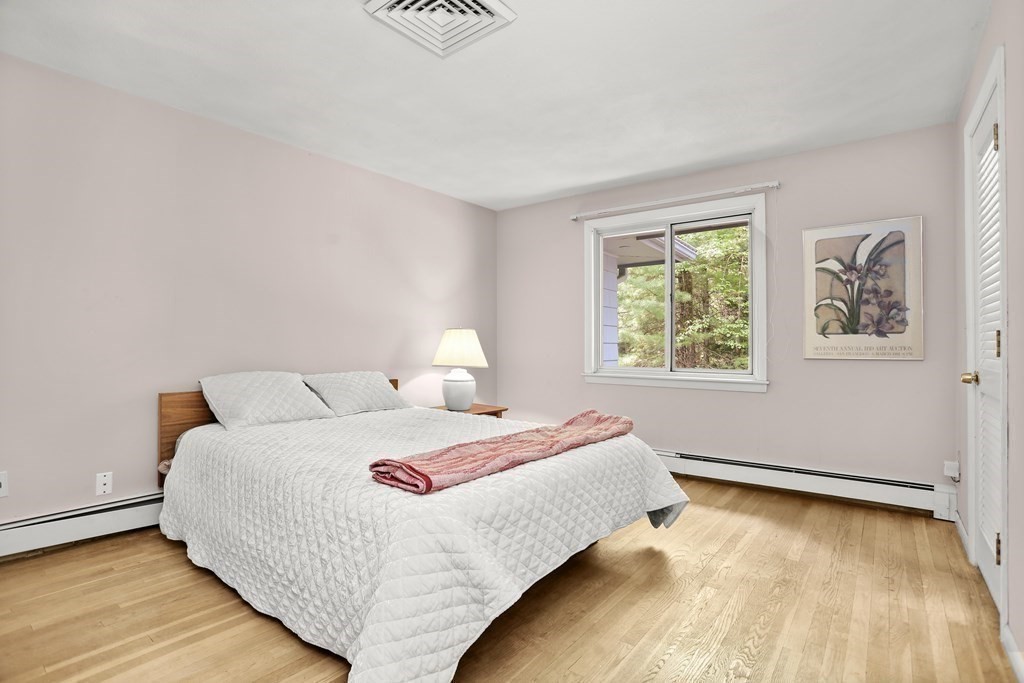 23 Suzanne Road Lexington, MA 02420 - Photo 21 of 36 a bedroom with a bed and a window