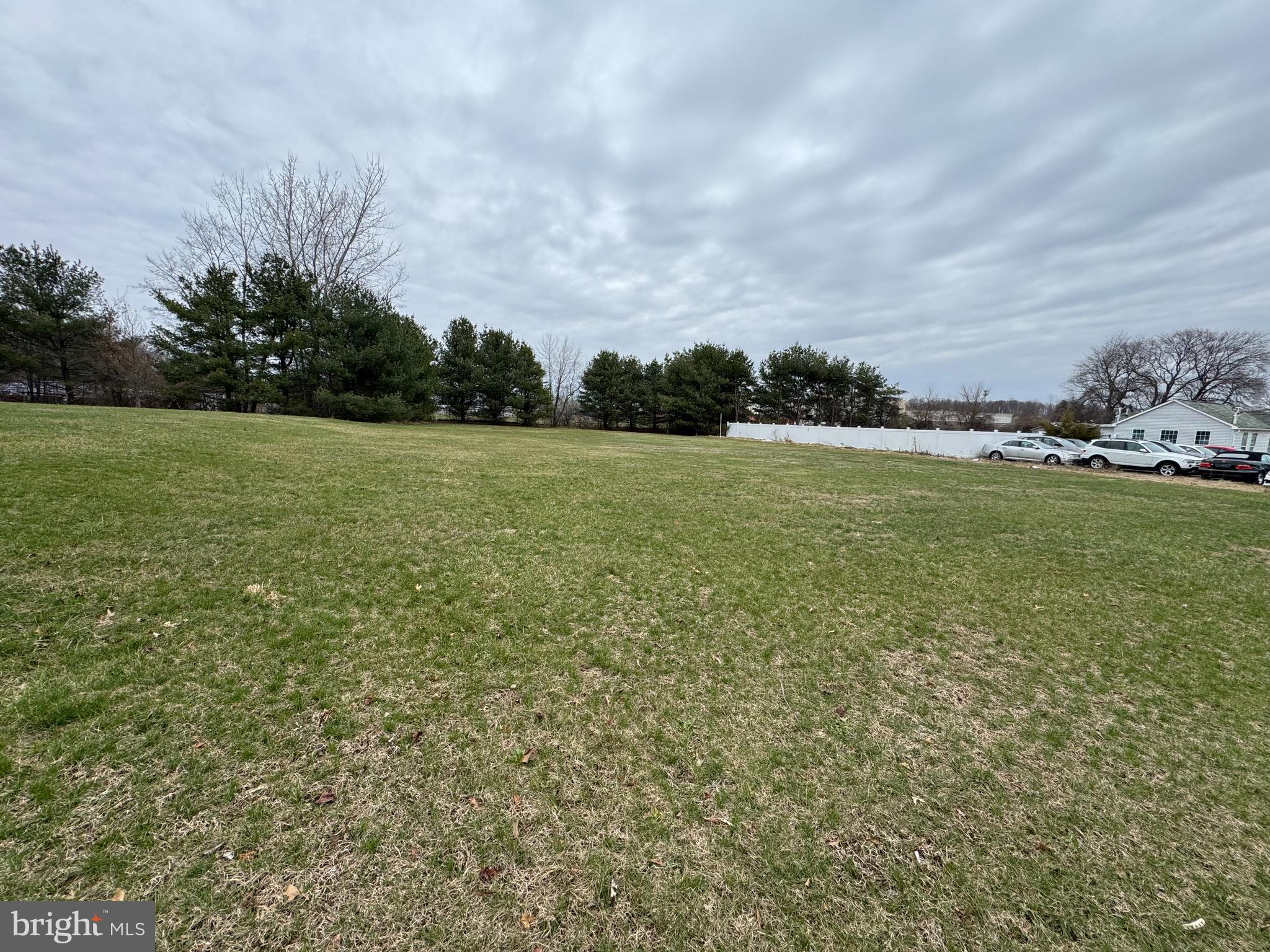 2551 Saylors Pond Road Wrightstown, NJ 08562 - Photo 3 of 4 a view of a field with an trees in front of it