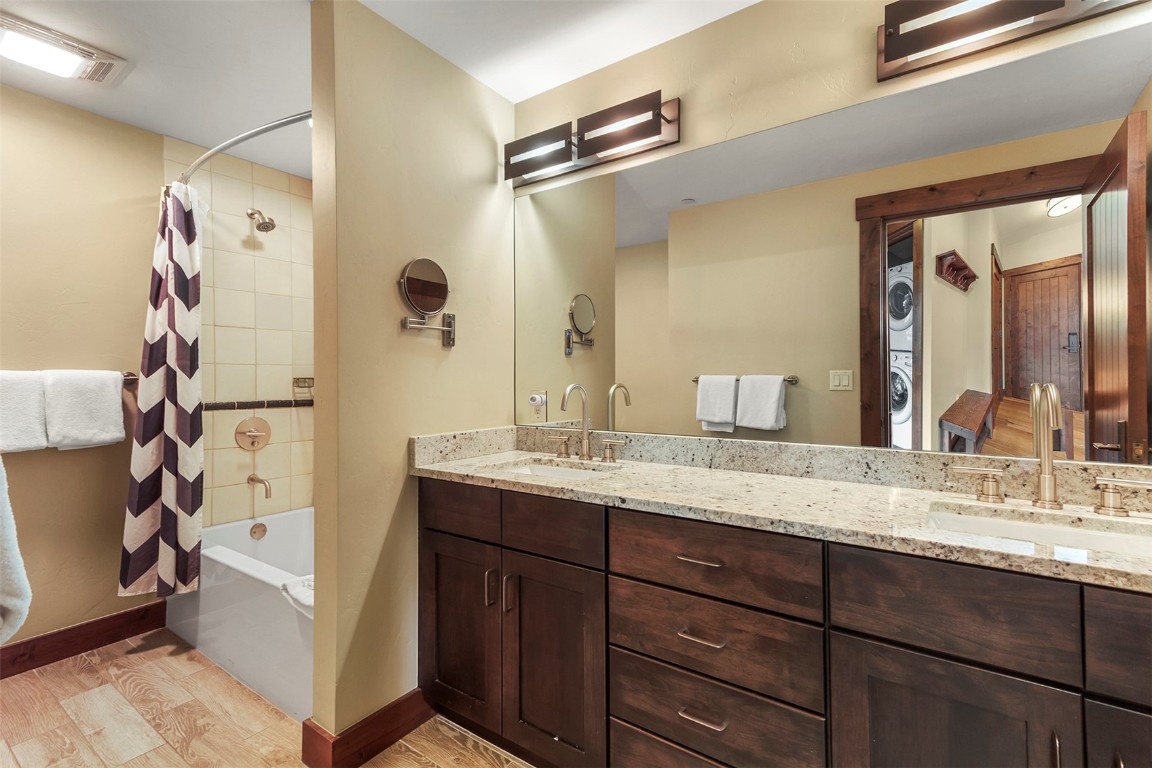 610 Columbine Road, Unit 6306 Breckenridge, CO 80424 - Photo 4 of 38 a bathroom with a granite countertop sink mirror and double