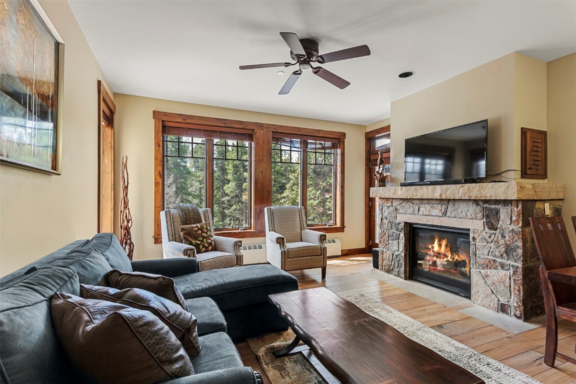610 Columbine Road, Unit 6306 Breckenridge, CO 80424 - Photo 5 of 38 a living room with furniture a window and a fireplace