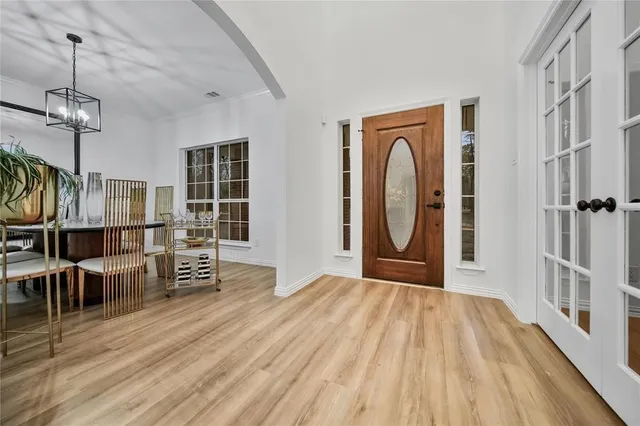 a view of a livingroom with wooden floor and stairs
