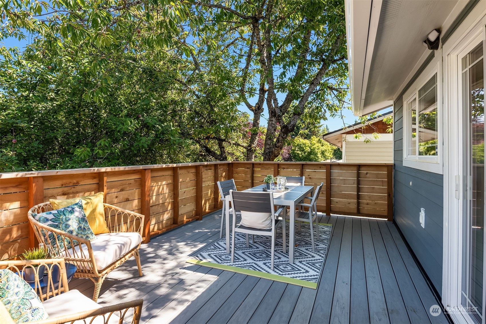 209 225th Place Southwest Bothell, WA 98021 - Photo 12 of 29 a balcony with wooden floor and outdoor seating