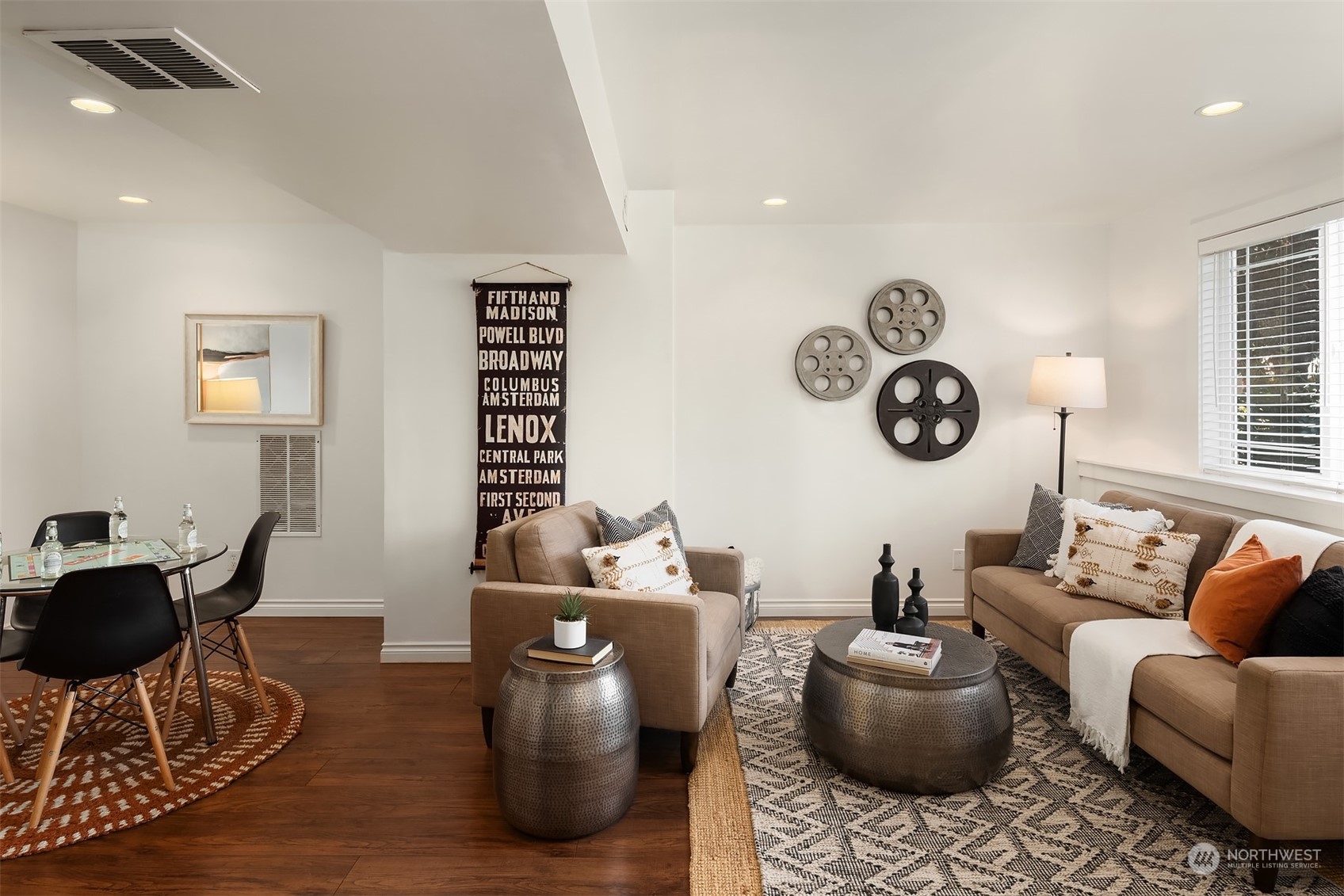 209 225th Place Southwest Bothell, WA 98021 - Photo 22 of 29 a living room with furniture a clock on wall and a window