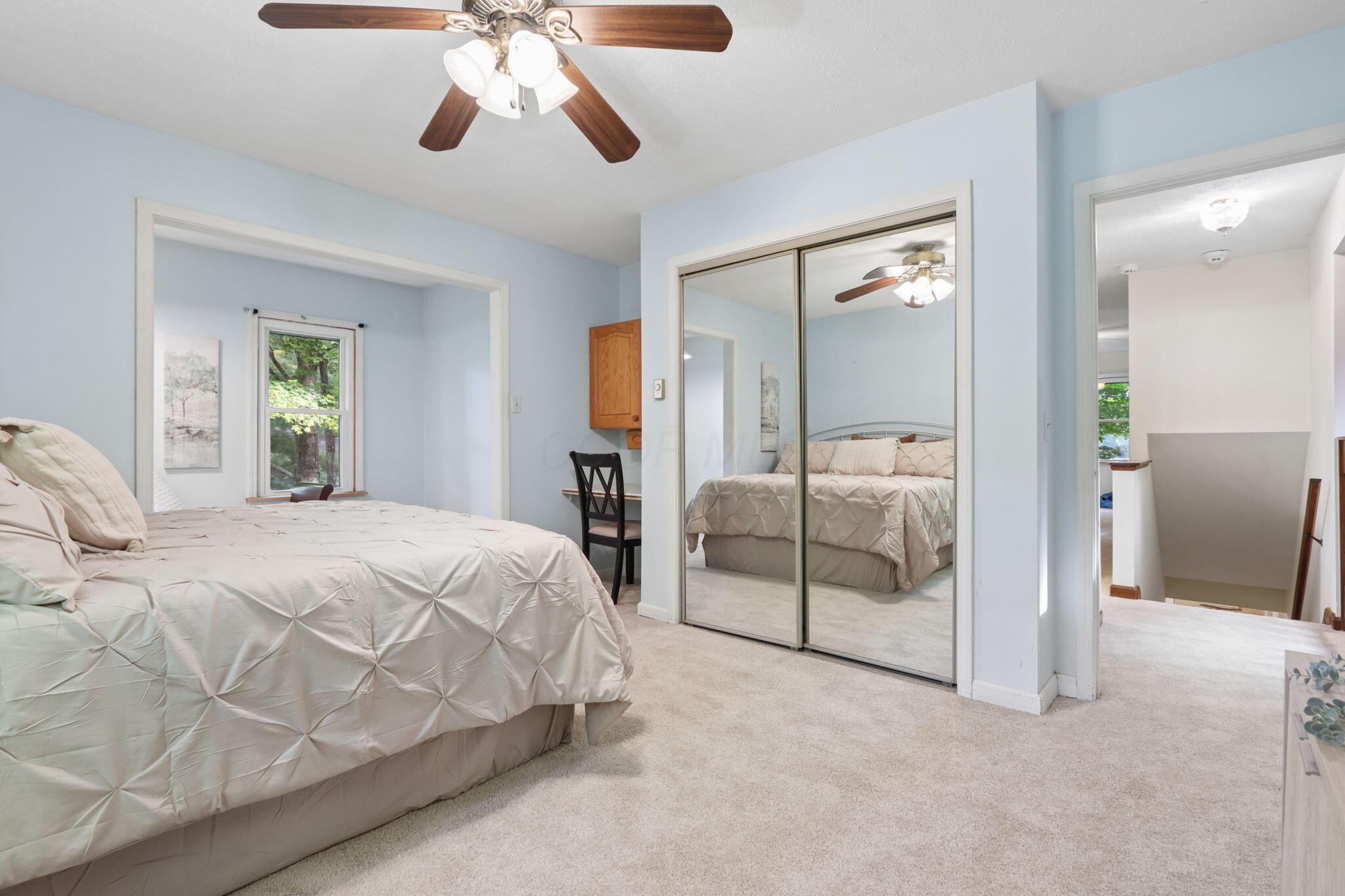 7115 Watkins Road Southwest Pataskala, OH 43062 - Photo 26 of 43 Newly carpeted bedroom with mirrored closet doors