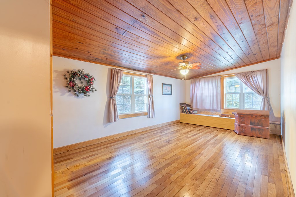 133 TJ Lane Murphy, NC 28906 - Photo 18 of 23 an empty room with wooden floor and windows