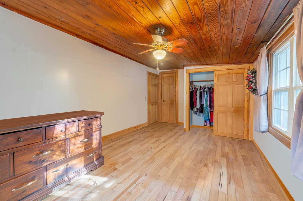 133 TJ Lane Murphy, NC 28906 - Photo 20 of 23 a view of empty room with wooden floor and fan