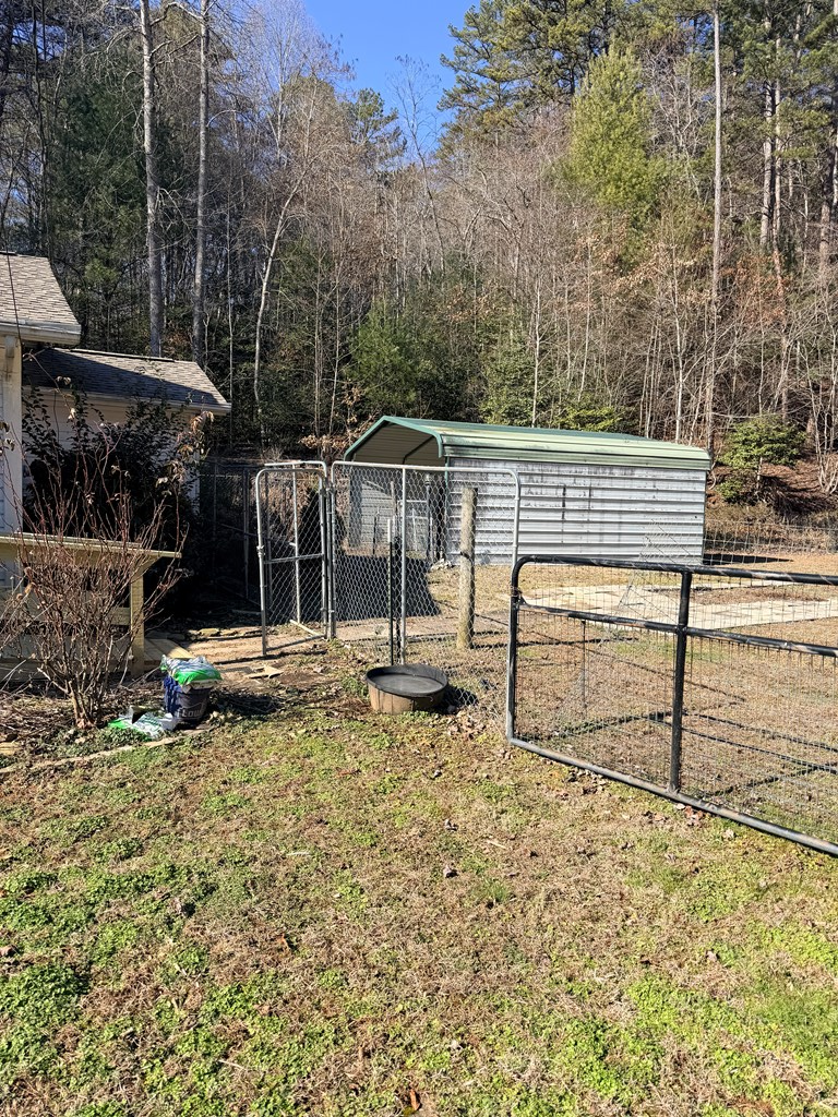 133 TJ Lane Murphy, NC 28906 - Photo 6 of 23 a house view with a backyard space
