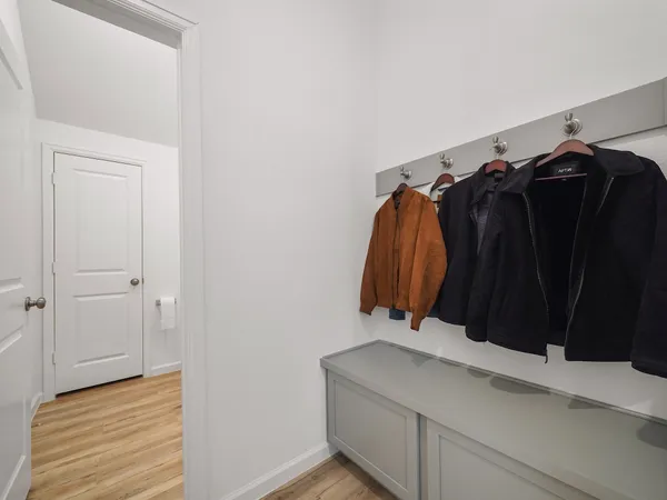 a view of walk in closet with clothes