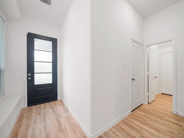 a view of wooden floor in an empty room