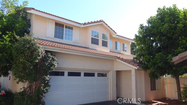 16731 Parthenia Street, Unit 3 Northridge, CA 91343 - Photo 1 of 37 a front view of a house with a garden