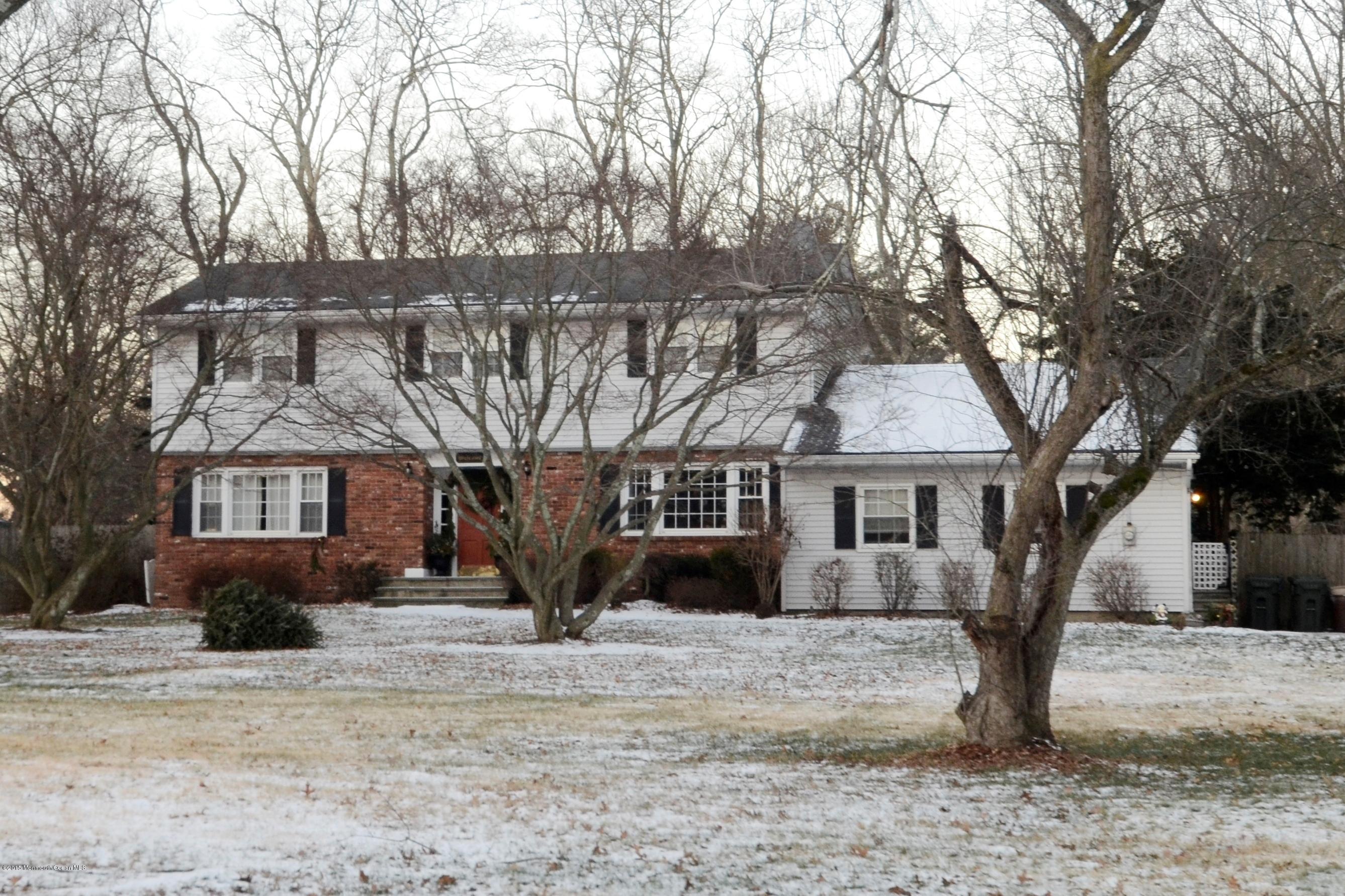 44 Farm Road Middletown, NJ 07748 - Photo 1 of 17 a front view of a house with a yard