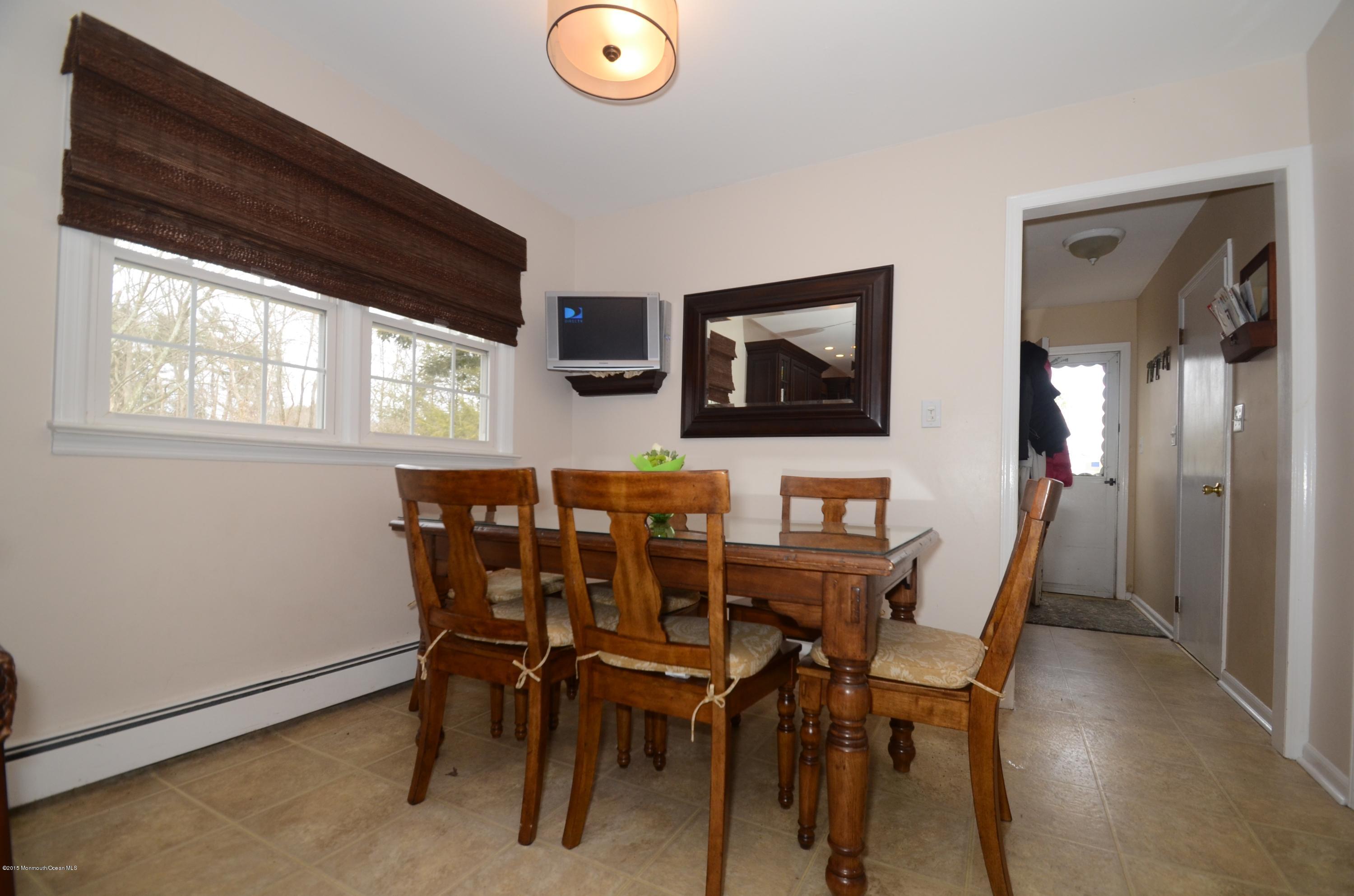 44 Farm Road Middletown, NJ 07748 - Photo 13 of 17 a view of a dining room with furniture and window