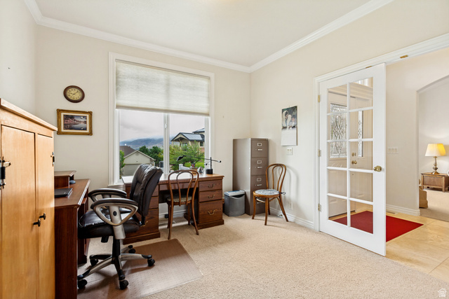 298 North Canyon Road Bountiful, UT 84010 - Photo 10 of 57 Bright room featuring an expansive window with mountain scenery, crown molding, and a paneled glass door