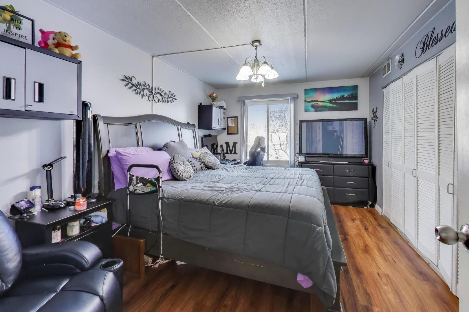 841 North York Street, Unit 109 Elmhurst, IL 60126 - Photo 13 of 34 a bedroom with bed and window