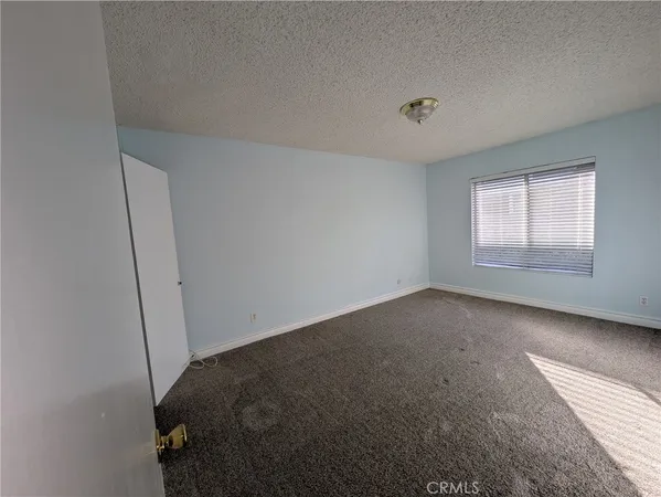 a view of a room that has a window in it