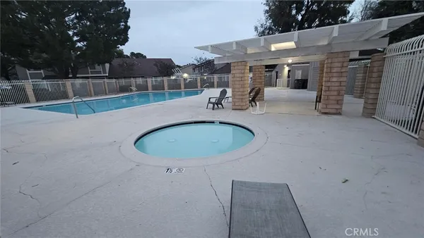 a view of a swimming pool with a patio