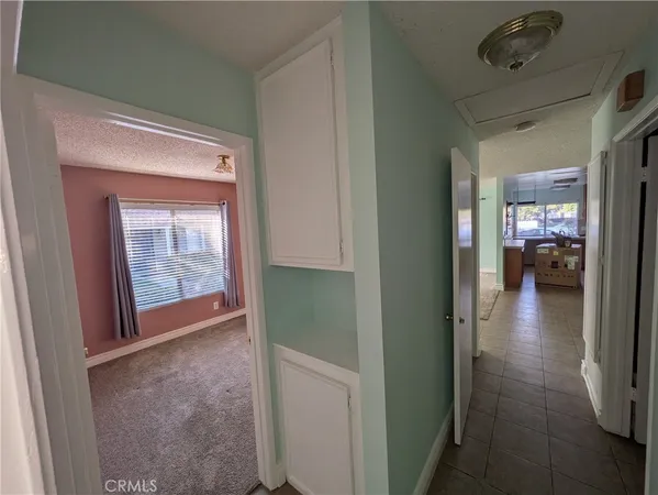 a view of hallway with livingroom and hardwood