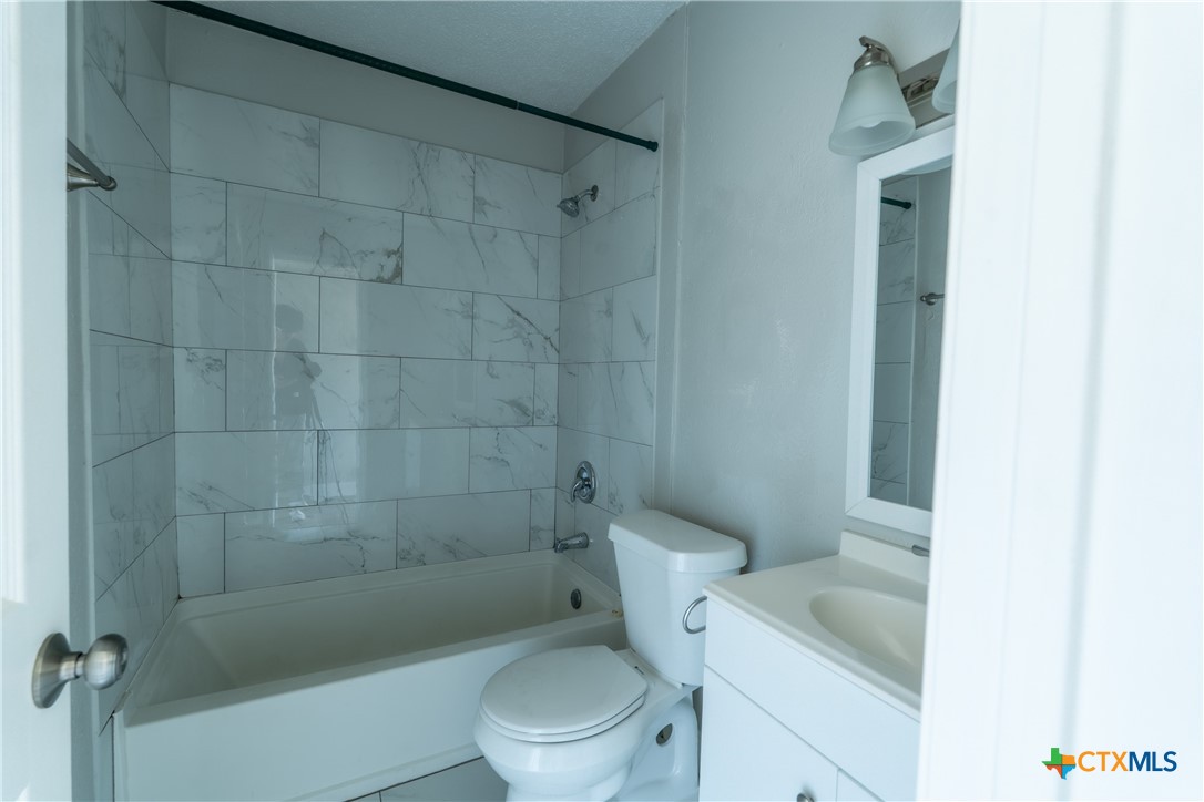 512 Sunset Lane, Unit AD Copperas Cove, TX 76522 - Photo 14 of 23 a white toilet sitting next to a bath tub