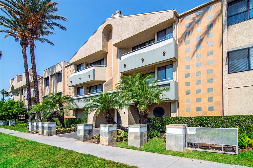 19009 Sherman Way, Unit 59 Reseda, CA 91335 - Photo 1 of 1 a front view of a house with garden