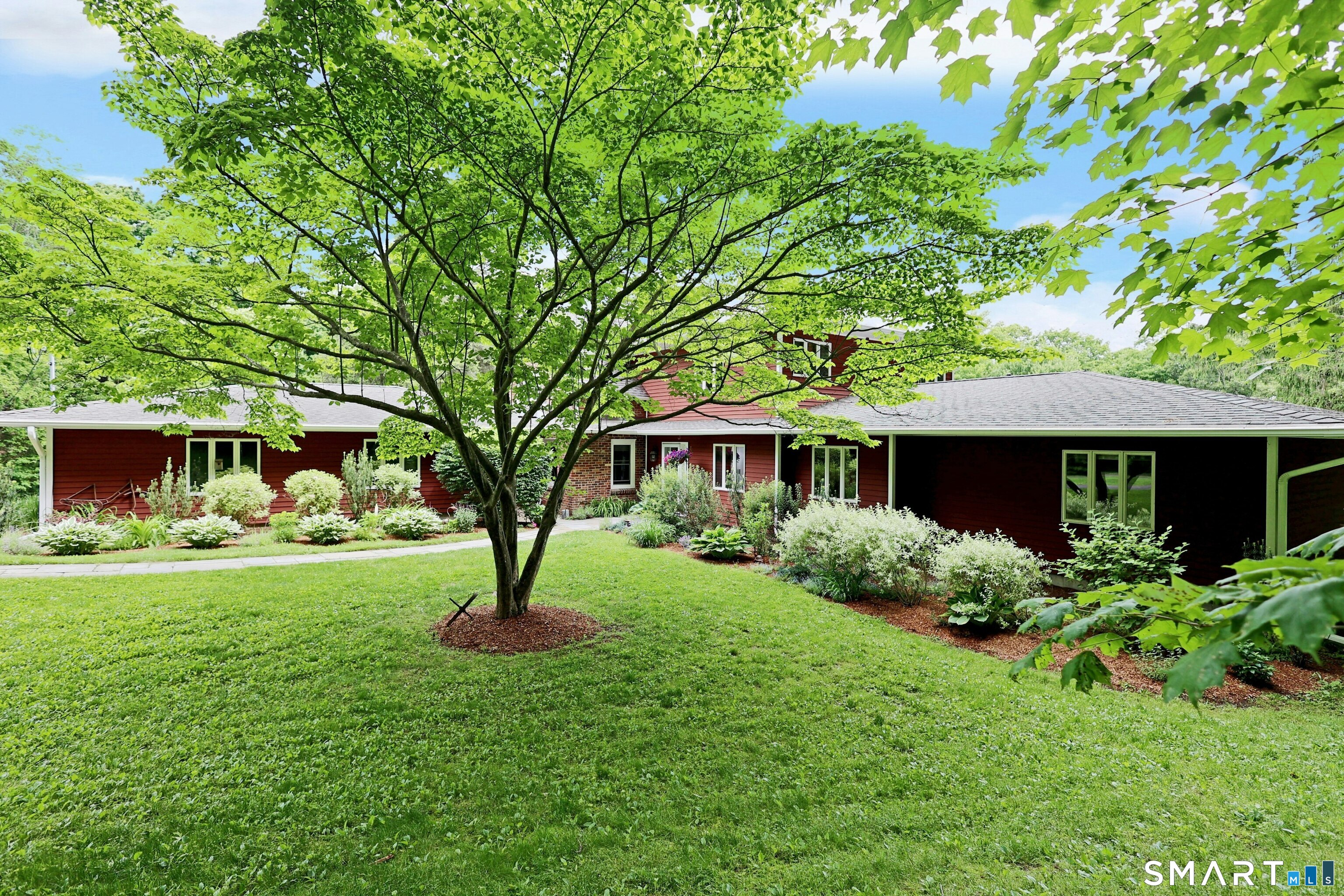 68 Bloomer Road Ridgefield, CT 06877 - Photo 10 of 40 a front view of a house with garden