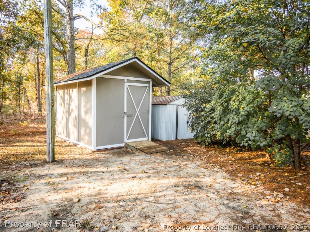 2601 Calloway Road Raeford, NC 28376 - Photo 33 of 34 a view of wooden house with large trees