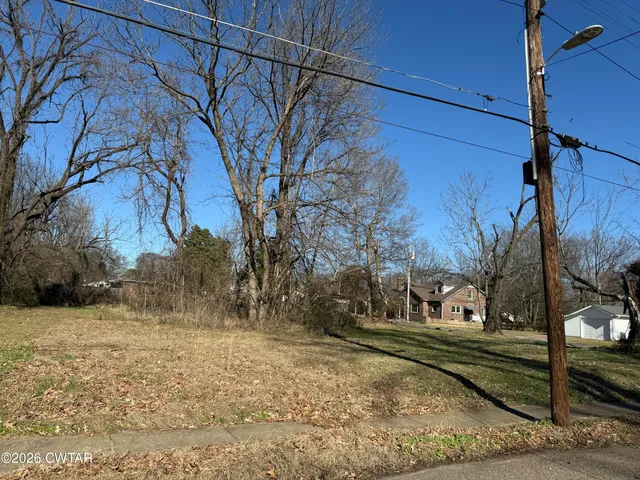 a view of a yard covered with snow
