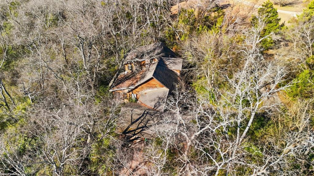 4640 Noell Road Van Alstyne, TX 75495 - Photo 27 of 34 a backyard of a house with lots of green space and shower