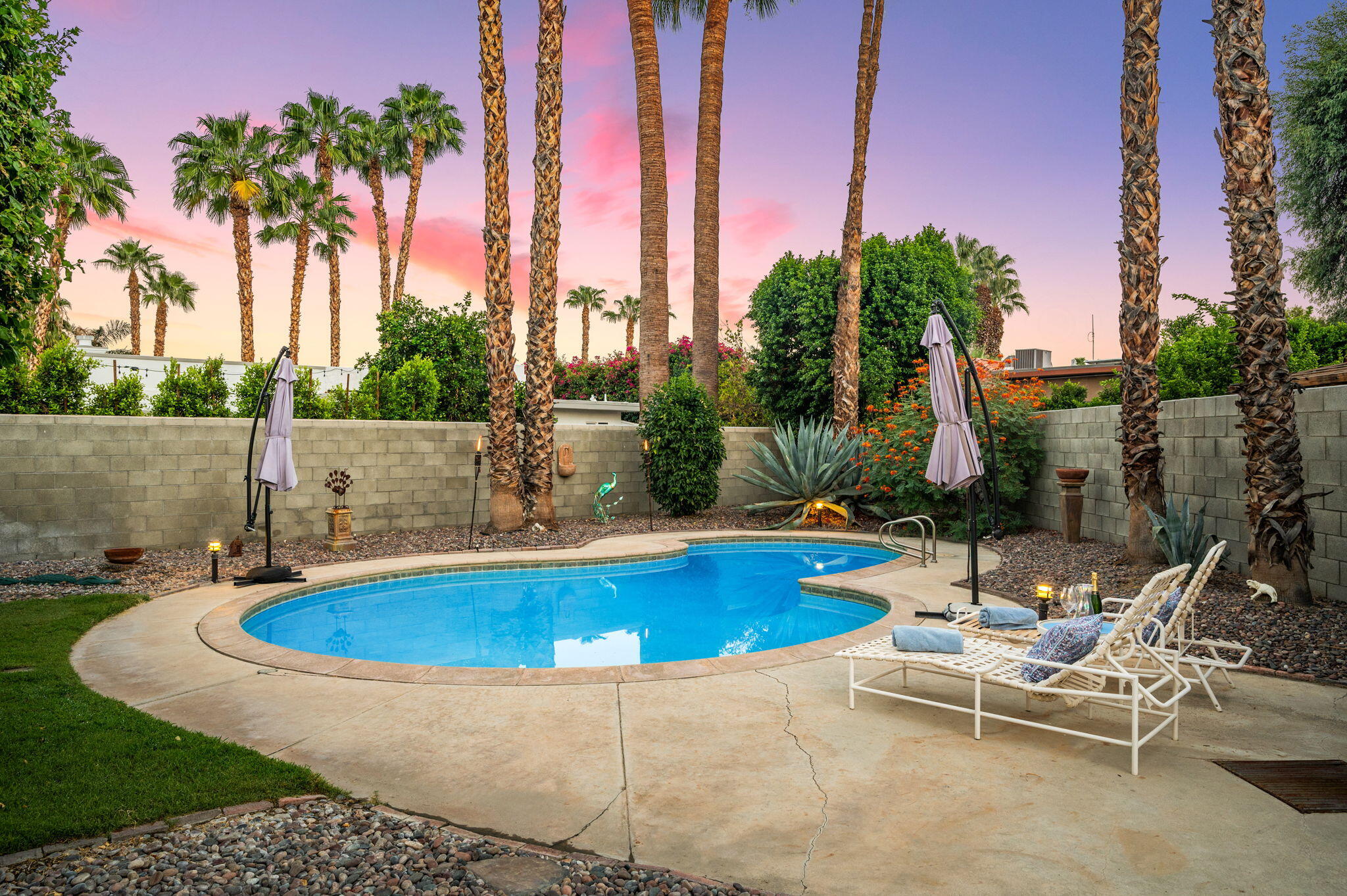 71888 Vista Del Rio Rancho Mirage, CA 92270 - Photo 1 of 36 a view of swimming pool with chairs