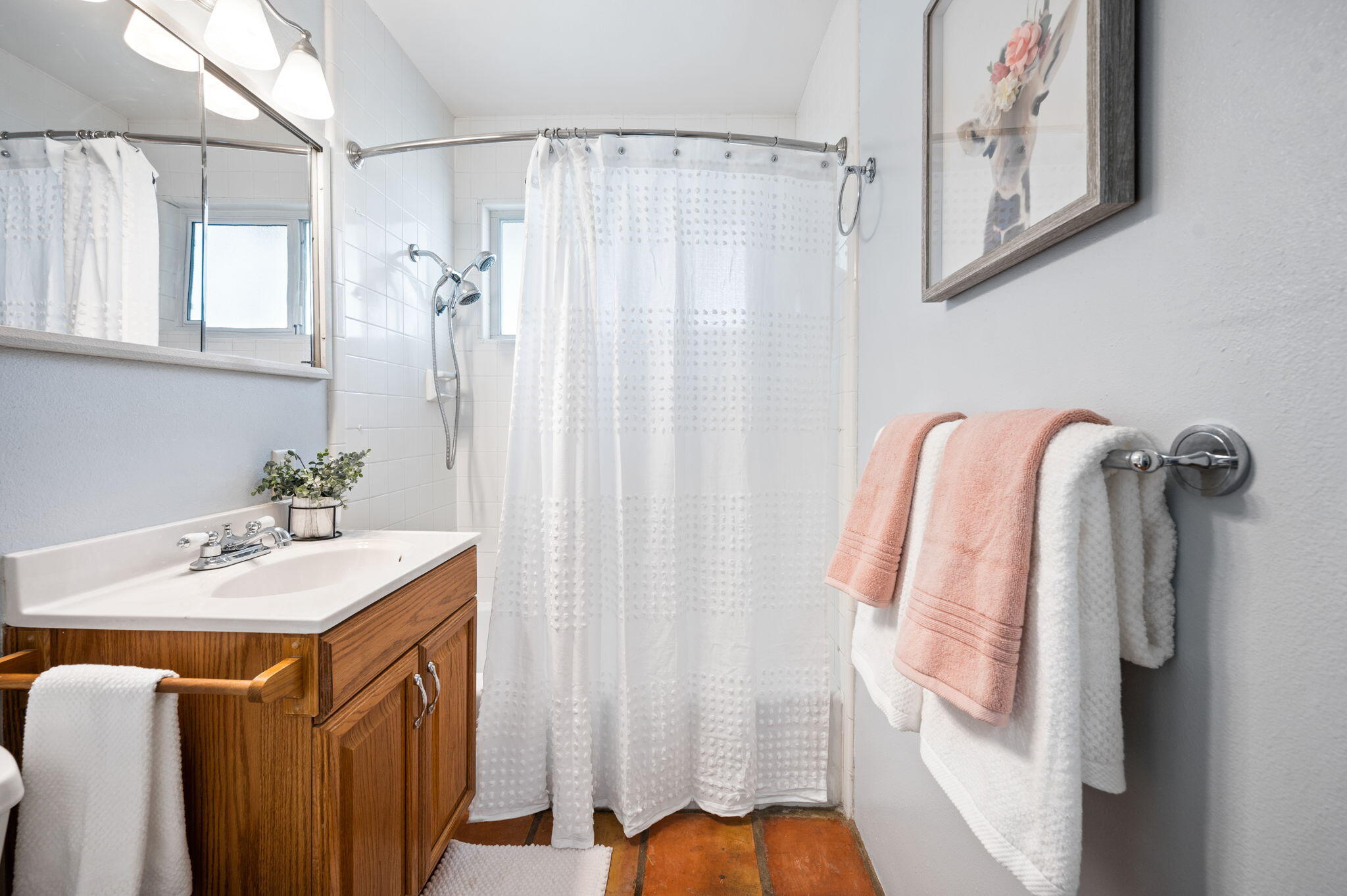 71888 Vista Del Rio Rancho Mirage, CA 92270 - Photo 18 of 36 a bathroom with a sink a mirror and a shower