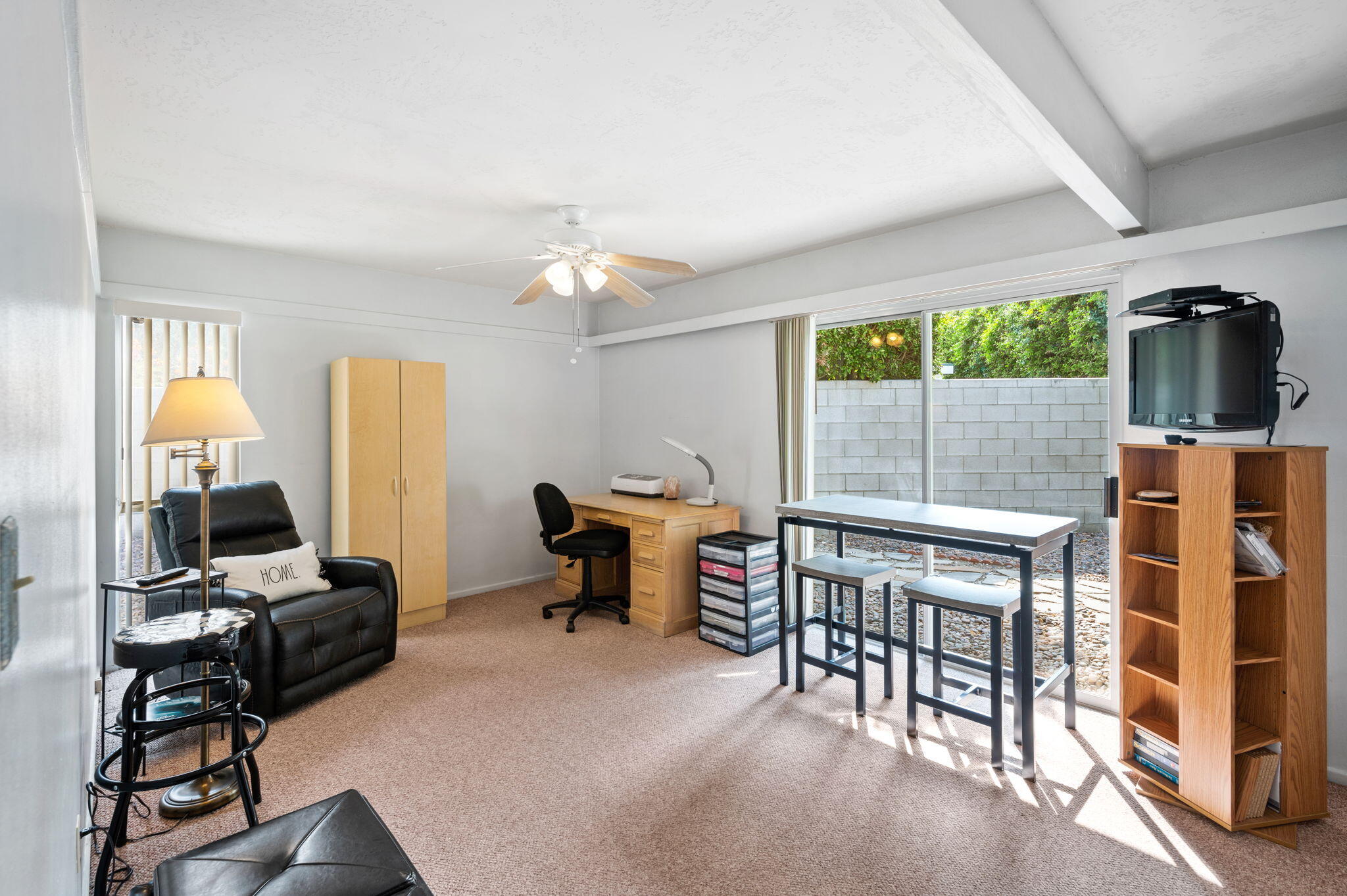 71888 Vista Del Rio Rancho Mirage, CA 92270 - Photo 20 of 36 a view of a workspace with furniture and a window