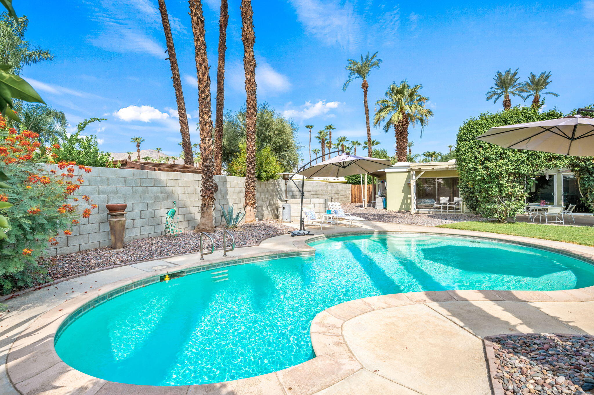 71888 Vista Del Rio Rancho Mirage, CA 92270 - Photo 22 of 36 a view of a swimming pool with an outdoor seating