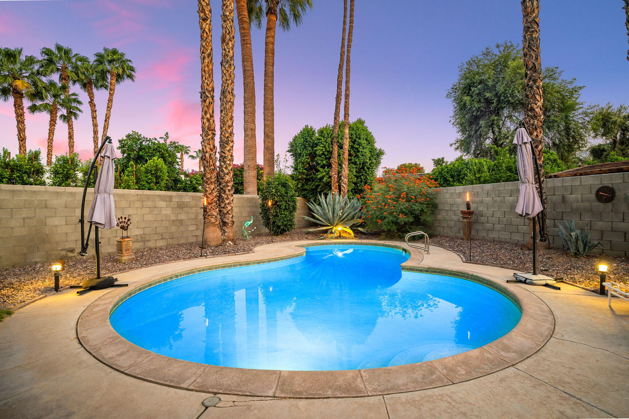 71888 Vista Del Rio Rancho Mirage, CA 92270 - Photo 27 of 36 a view of a swimming pool with a patio