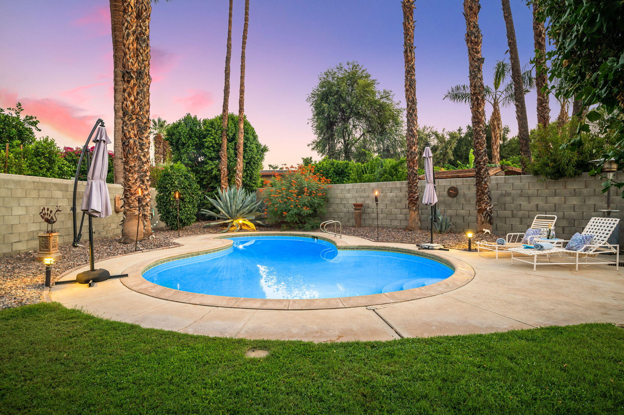 71888 Vista Del Rio Rancho Mirage, CA 92270 - Photo 28 of 36 a view of a backyard with swimming pool