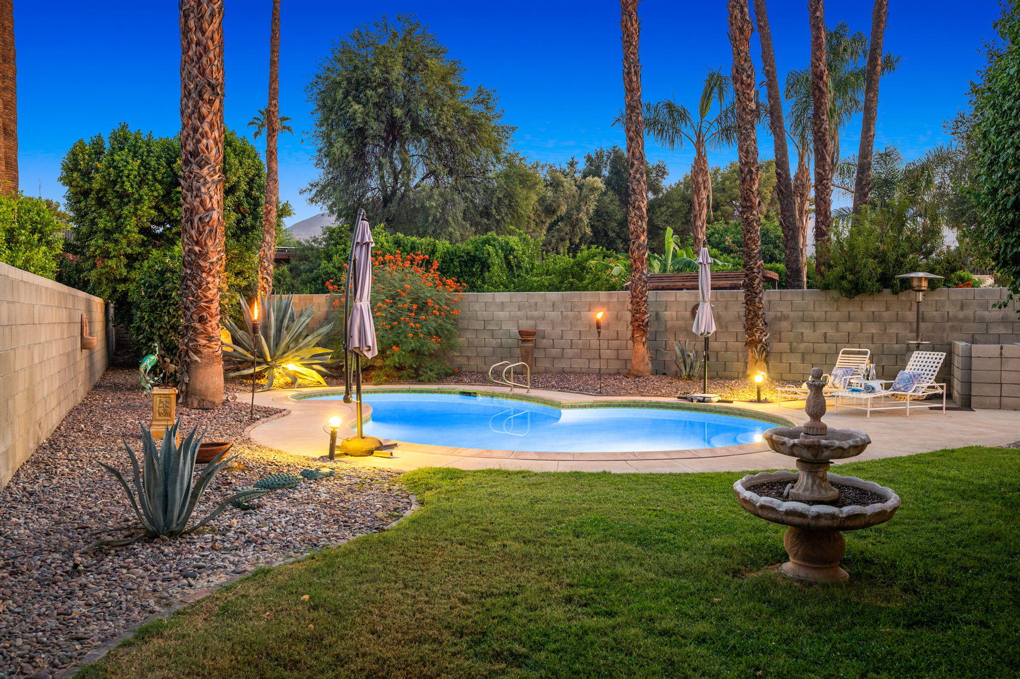 71888 Vista Del Rio Rancho Mirage, CA 92270 - Photo 30 of 36 a view of a backyard with swimming pool