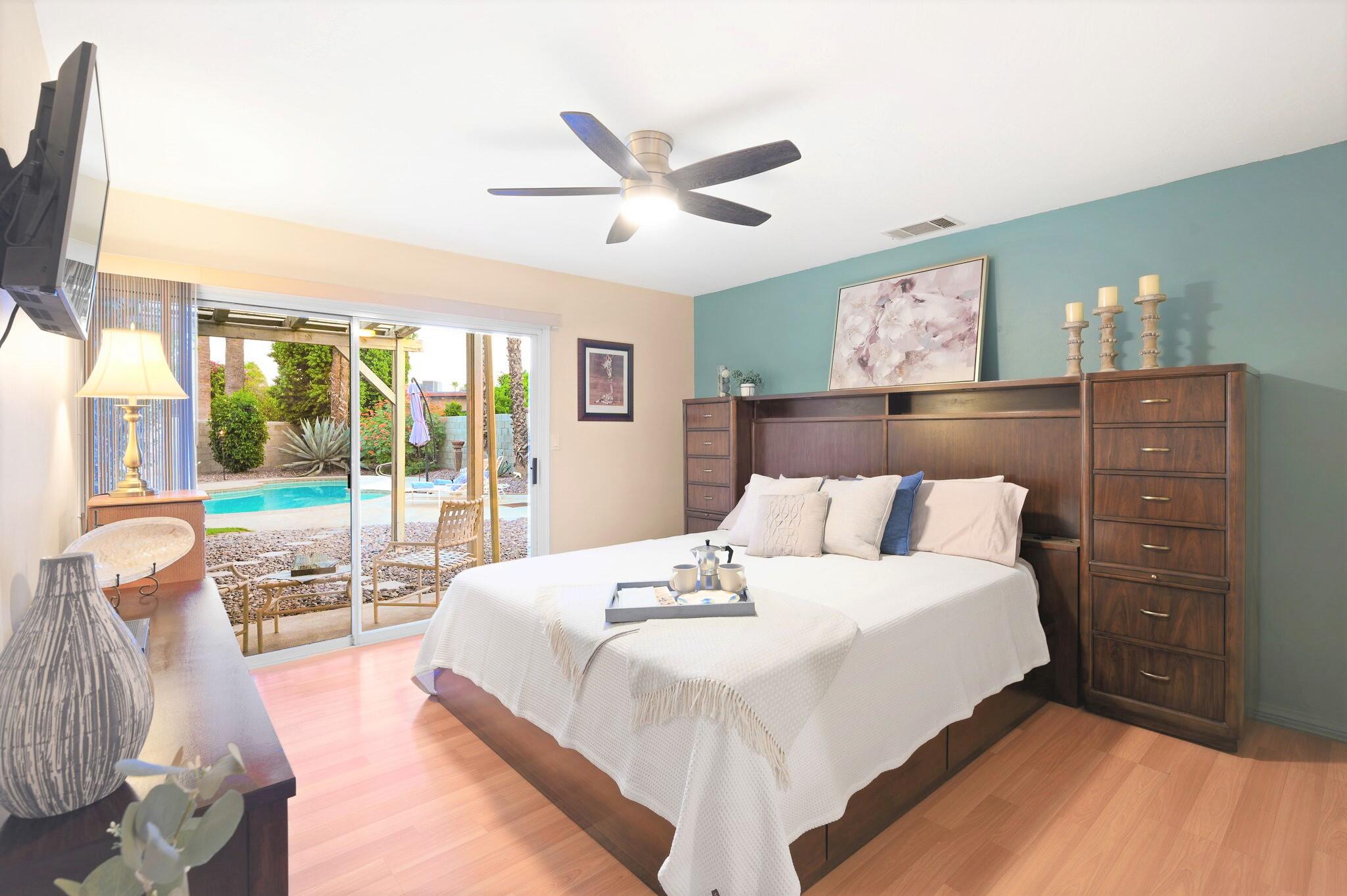 71888 Vista Del Rio Rancho Mirage, CA 92270 - Photo 5 of 36 a bedroom with a large bed and a window