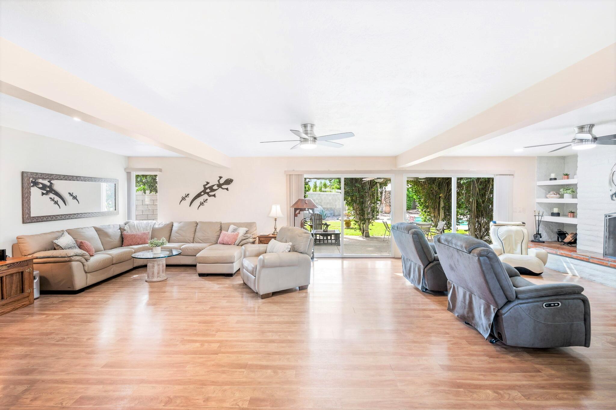 71888 Vista Del Rio Rancho Mirage, CA 92270 - Photo 6 of 36 a living room with furniture and large windows