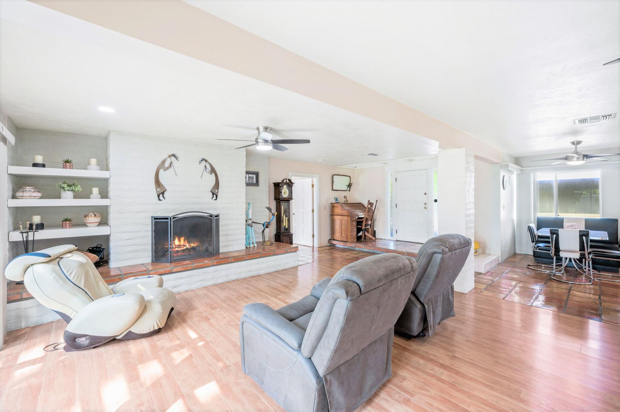71888 Vista Del Rio Rancho Mirage, CA 92270 - Photo 7 of 36 a living room with furniture and a fireplace