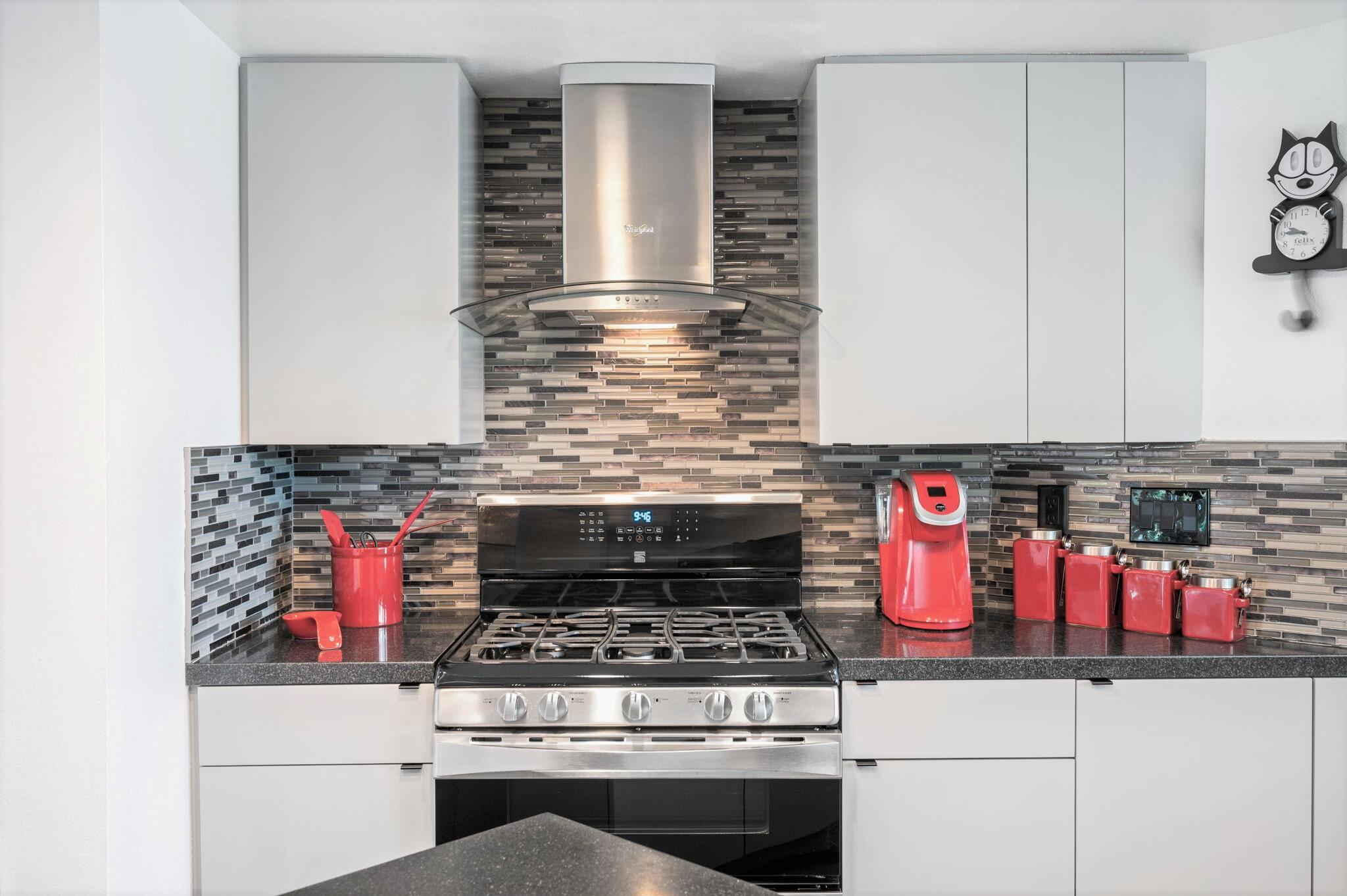 71888 Vista Del Rio Rancho Mirage, CA 92270 - Photo 10 of 36 a stove top oven sitting inside of a kitchen