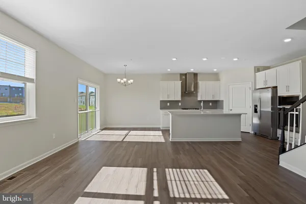 a view of kitchen with cabinets and wooden floor