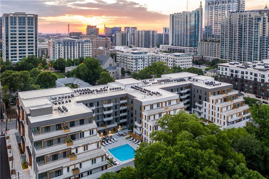 775 Juniper Street Northeast, Unit 404 Atlanta, GA 30308 - Photo 13 of 22 a view of a building with a garden and trees
