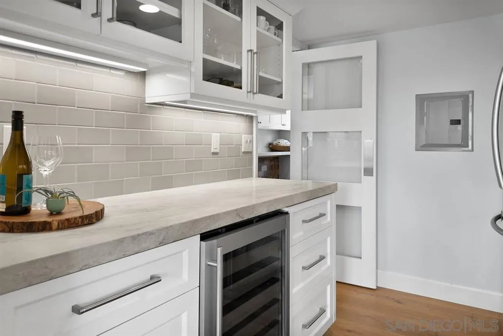 7190 Vía Mariposa Norte Bonsall, CA 92003 - Photo 11 of 25 a kitchen with stainless steel appliances a sink and cabinets