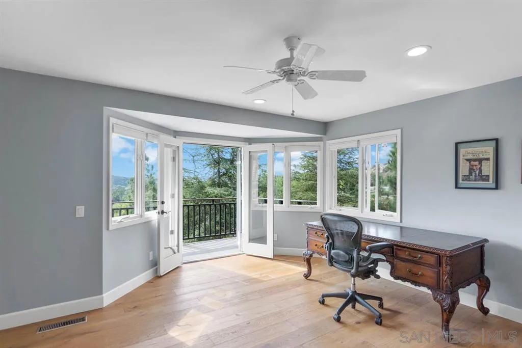 7190 Vía Mariposa Norte Bonsall, CA 92003 - Photo 18 of 25 a workspace with wooden floor and a window