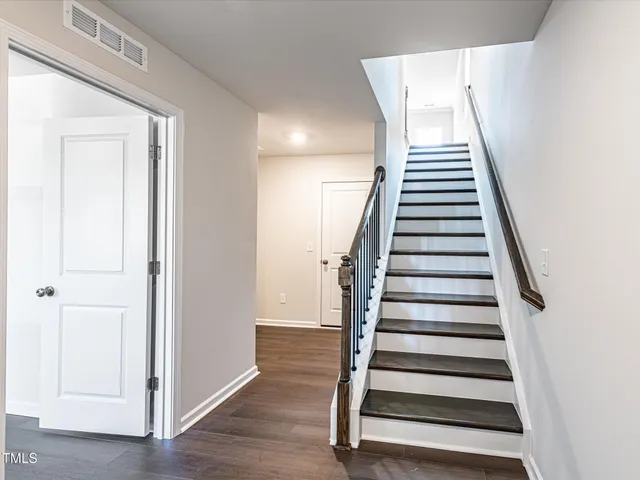 a view of entryway with wooden floor