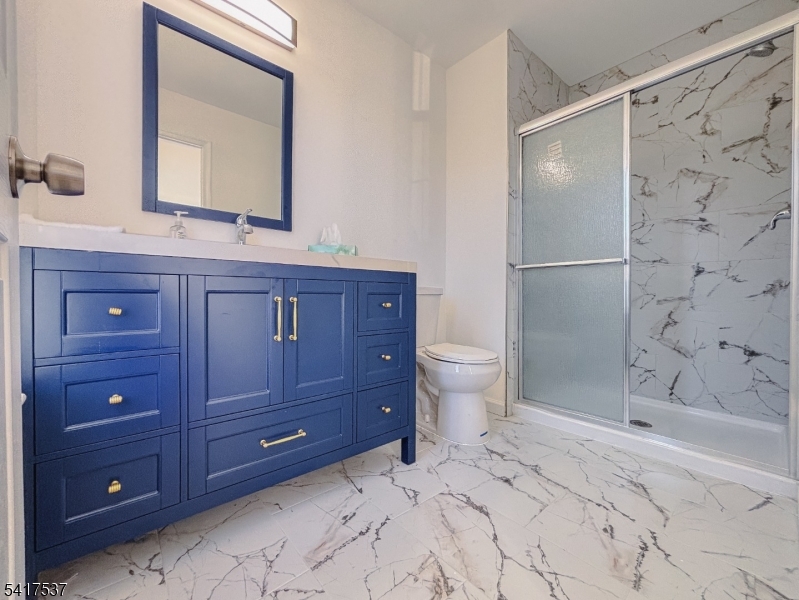 386 Inwood Court Somerset, NJ 08873 - Photo 20 of 34 a bathroom with a granite countertop sink toilet and shower