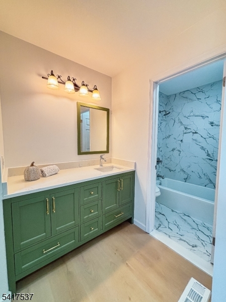 386 Inwood Court Somerset, NJ 08873 - Photo 25 of 34 a bathroom with a double vanity sink and a bathtub