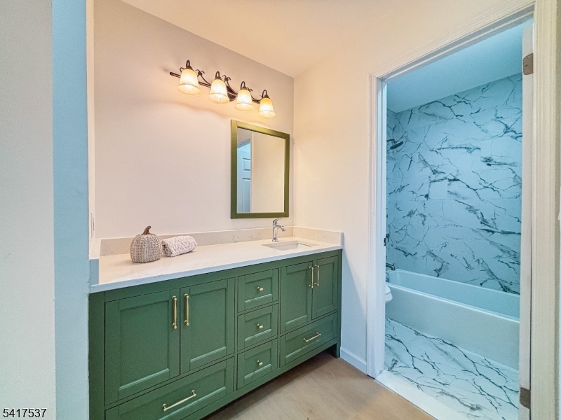 386 Inwood Court Somerset, NJ 08873 - Photo 30 of 34 a bathroom with a bathtub sink and mirror