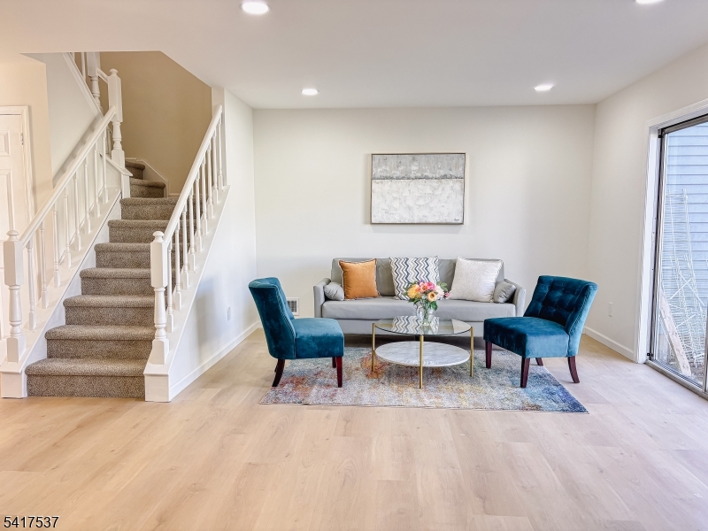 386 Inwood Court Somerset, NJ 08873 - Photo 7 of 34 a living room with furniture and a wooden floor