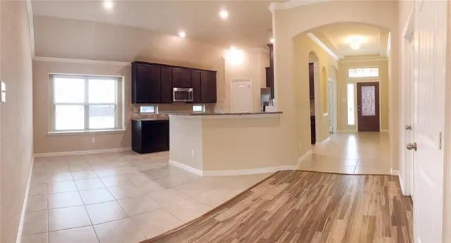 a view of kitchen with furniture and wooden floor