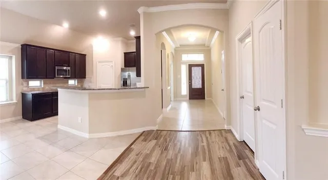 a view of a kitchen from the hallway